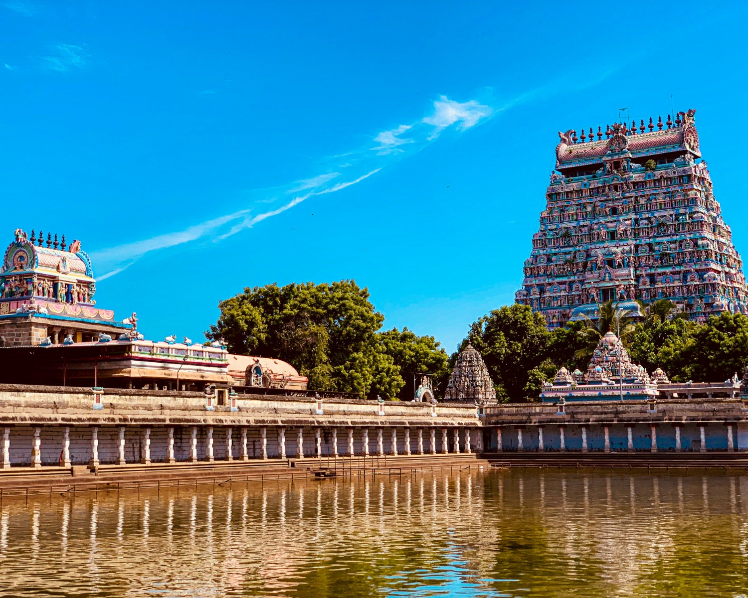 Meenakshi Amman Temple gopuram towers illuminated at sunset