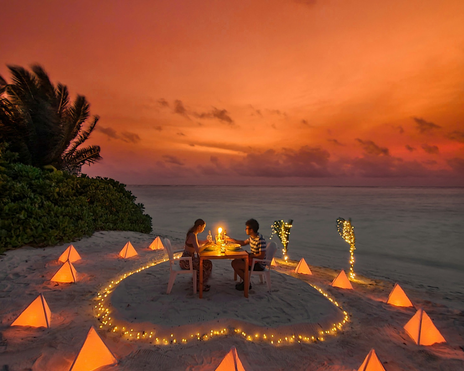 Candlelit dinner on the beach under the stars