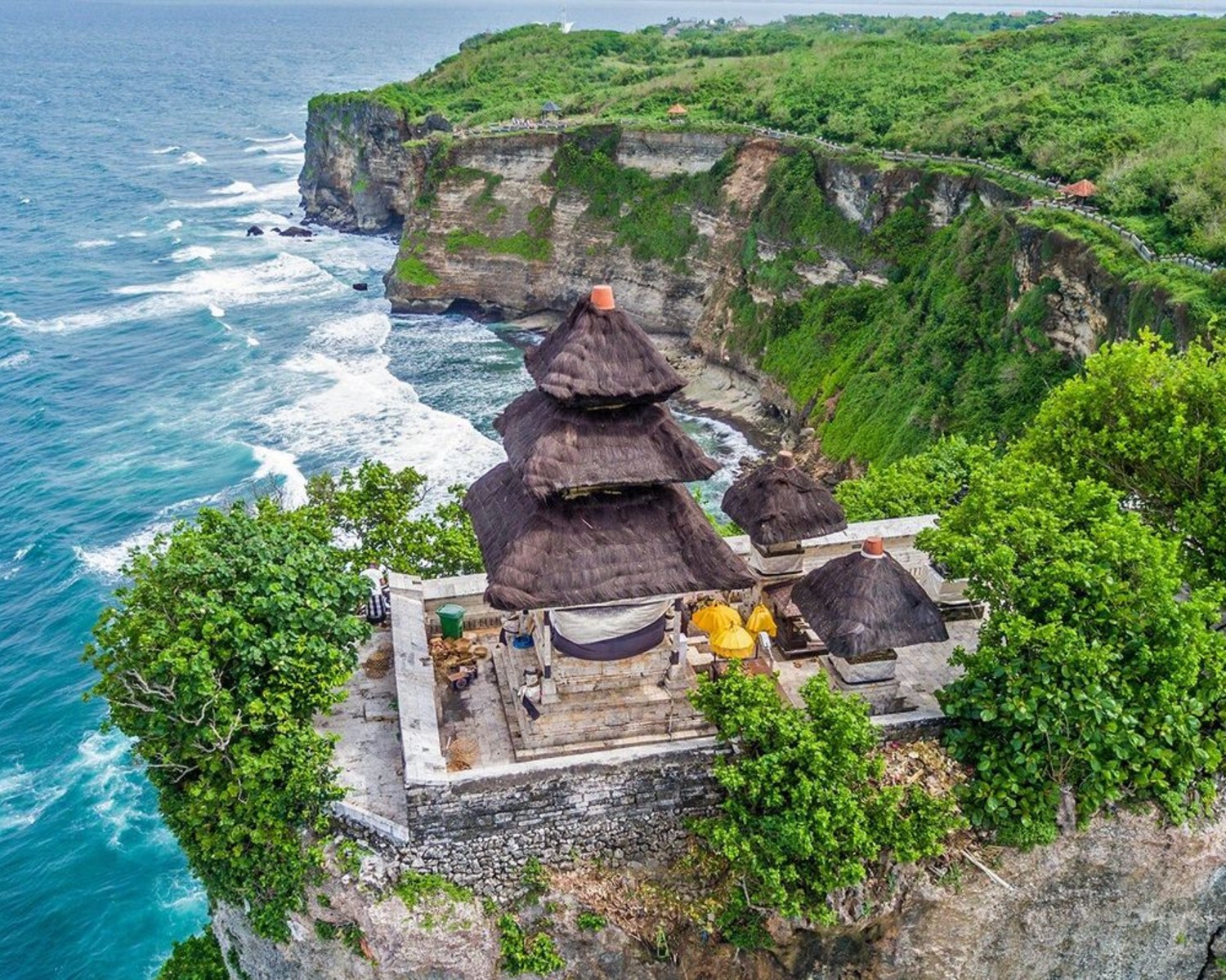 Uluwatu Temple perched on dramatic cliffs at sunset