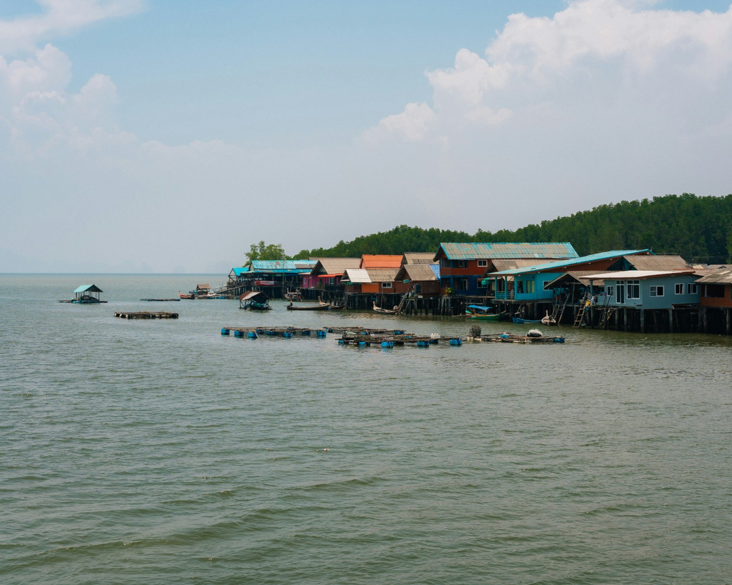 Slow boat cruising along the misty Mekong at sunrise