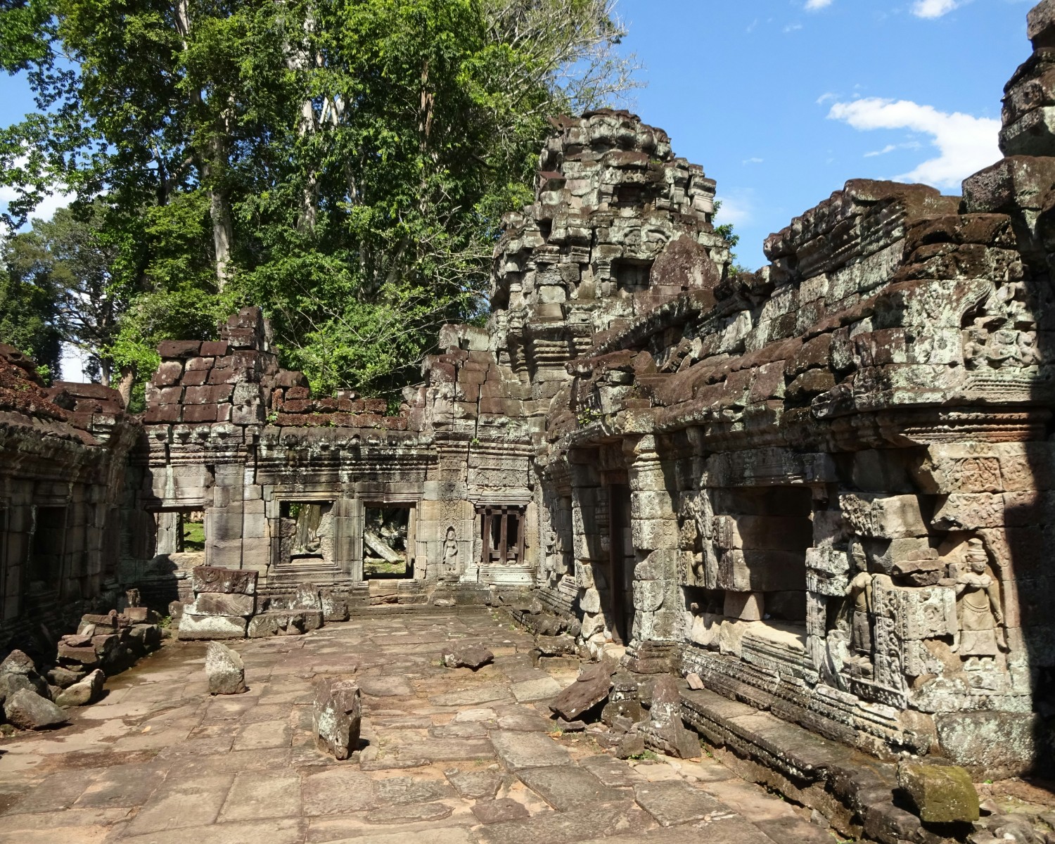 Ancient Vat Phou temple ruins against mountain backdrop