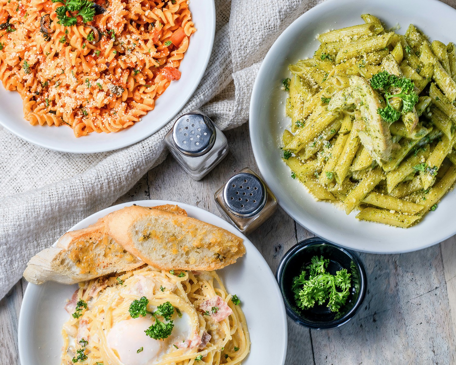 Italian pasta dishes showcasing regional traditions (Tagliatelle Bolognese, Pici)